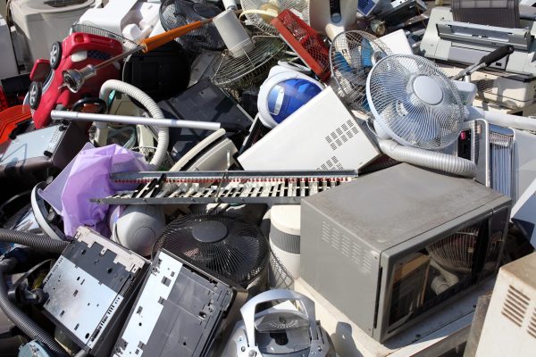 Mixed electronic and household waste illustrating the challenges and risks of cross-boundary waste shipments under the WEEE Directive.