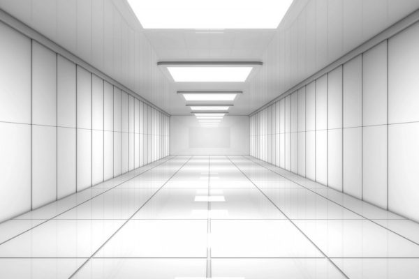 Empty, high-tech corridor representing a decommissioned server room after secure IT asset removal