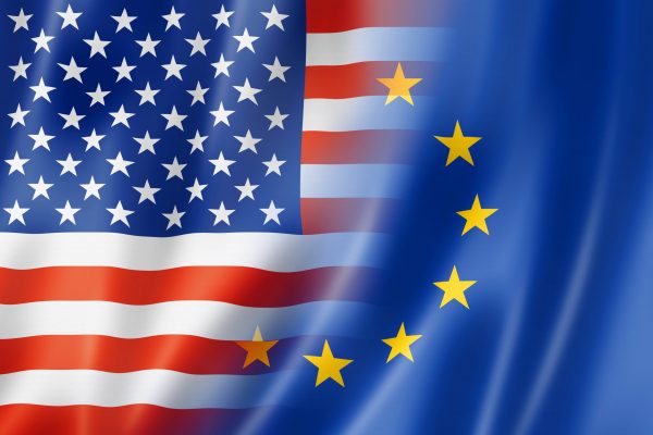 Overlay of the United States flag and the European Union flag representing two regulatory perspectives influencing the global ITAD industry.