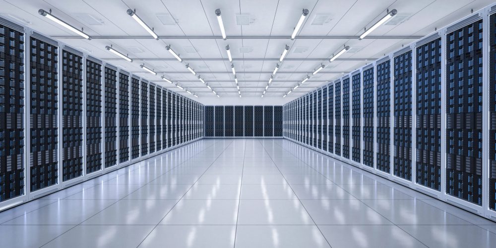 Modern data center with rows of black server racks in a white, sterile environment – illustrating the infrastructure behind IT asset disposition and compliance challenges.
